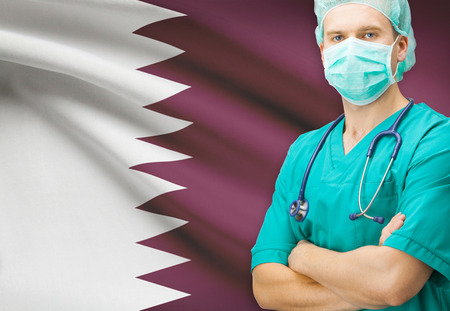Surgeon with national flag on background - Qatarの写真素材