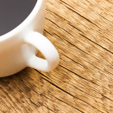 Close up shot of americano on old wooden tableの写真素材