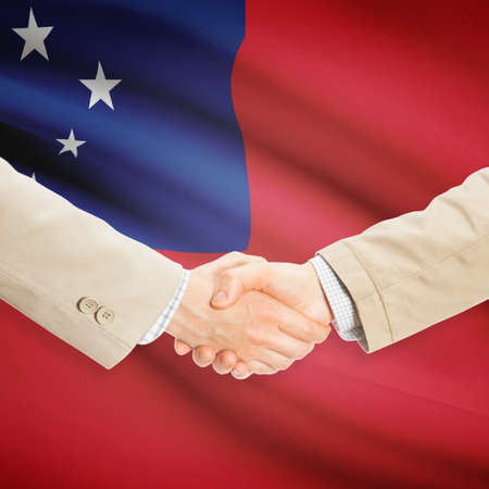 Businessmen shaking hands with flag on background - Samoaの写真素材