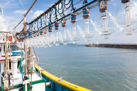 Squid fishing boat entering portの写真素材