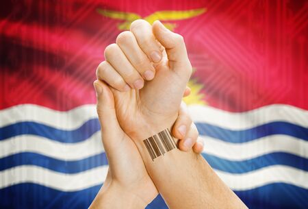 Barcode ID number on wrist of a human and national flag on background - Kiribatiの写真素材