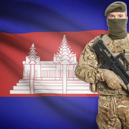 Soldier with machine gun and national flag on background series - Cambodia