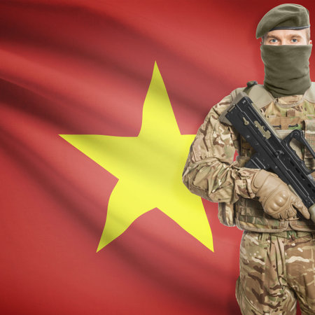 Soldier with machine gun and national flag on background series - Vietnam