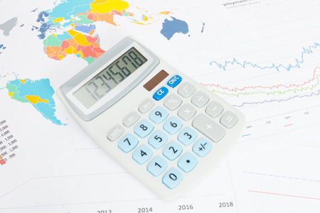 Data charts with calculator over it seriesの写真素材