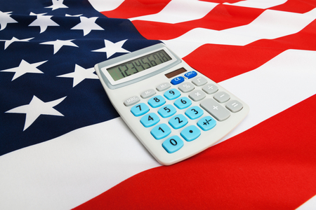 Part of ruffled national flag with calculator over it series - United Statesの写真素材