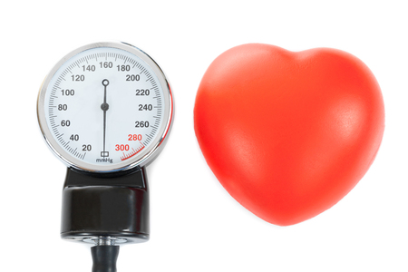 A manometer and a toy heart as symbols of health care systemの写真素材