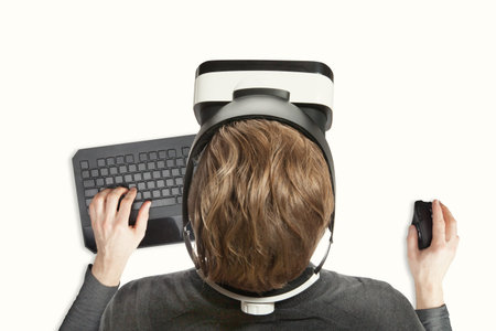 Indoors close up shot of male working with virtual reality glasses