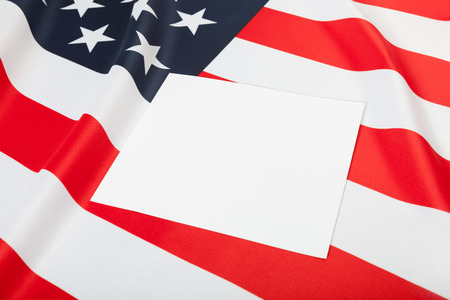 USA ruffled flag with blank text board over it for YOUR TEXT OR IMAGEの写真素材