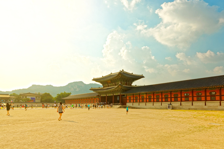SEOUL, KOREA - AUGUST 14, 2015: People walking by Gyeongbokgung Palace - main royal palace of the Joseon dynasty - Seoul, South Koreaのeditorial素材