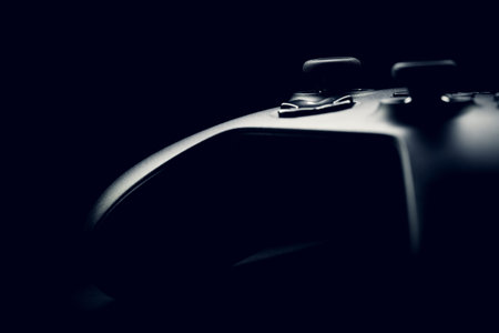 Neat gamepad on black background - studio shot