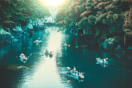 JEJU ISLAND, SOUTH KOREA - AUGUST 19, 2015: Lots of young people kayaking in a crystal clear waters of river that flows into ocean - Jeju island, South Koreaのeditorial素材