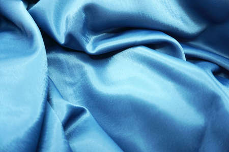 Blue satin fabric as background, top view. Space for textの写真素材