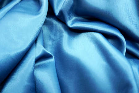 Blue satin fabric as background, closeup. Space for textの写真素材
