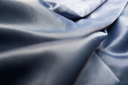 Blue satin fabric as background, closeup. Space for textの写真素材