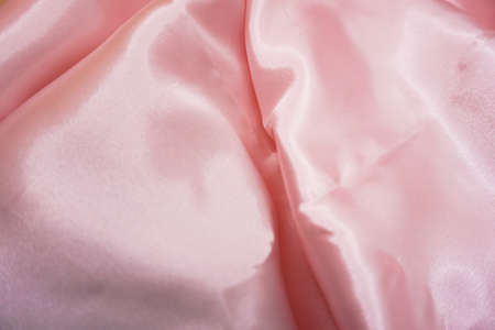 pink satin fabric texture useful as a background with copy spaceの写真素材