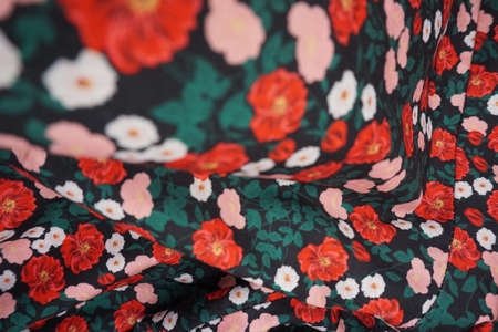 Texture, background, pattern, silk fabric, red flowers on a black backgroundの写真素材