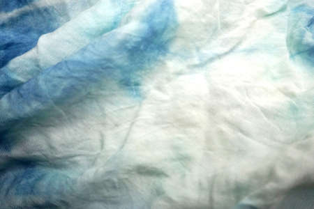 Blue and white crumpled fabric as background, closeup viewの写真素材