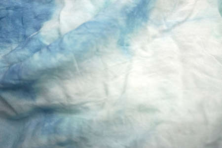 Blue and white crumpled fabric as background, closeup viewの写真素材