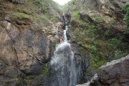Waterfall in the mountains. The concept of active and ecological tourismの写真素材