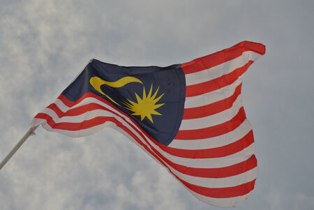 Malaysian flag in windy airの写真素材