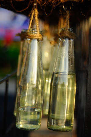 A number of decorative bottles hung in orderの写真素材