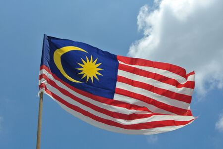 Malaysian Flag in windy air on August 17, 2014 at Seremban, Negeri Sembilan, Malaysia.の写真素材