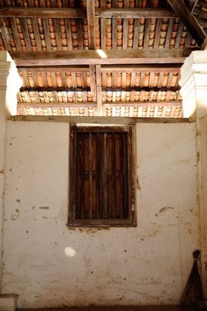 Window of The Old Mosque of Pengkalan Kakap located in Merbok Kedah Malaysia. It was build around 1800 with traditional Malay architectural style and considered as oldest Mosque in Pengkalan Kalap Kedah Malaysia.の写真素材
