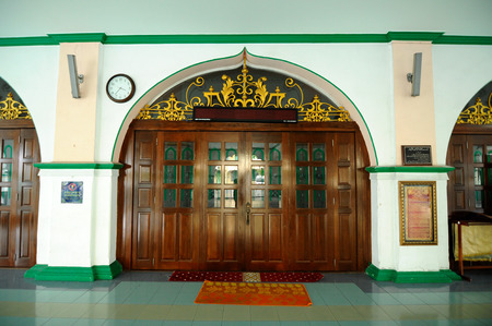 Main entrance door of the Indian Muslim Mosque in Ipoh, Perak, Malaysia on June 01, 2015. The mosque was built in 1908 also known as Town Padang Mosque.のeditorial素材