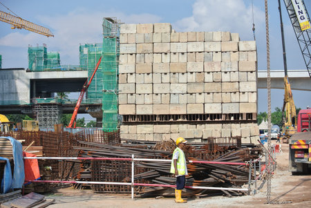 Construction workers stacking the maintain load test block at the construction site in Selangor,...