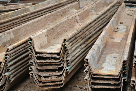 MALACCA, MALAYSIA  SEPTEMBER 15, 2015: Stack of retaining wall steel sheet pile cofferdam in the construction site in Malacca, Malaysia on September 15, 2015.のeditorial素材