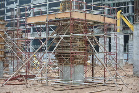 MALACCA, MALAYSIA -JUNE 18, 2016: Column timber form work and reinforcement bar at the construction site in Malacca, Malaysia. The structure supported by temporary wood supportのeditorial素材