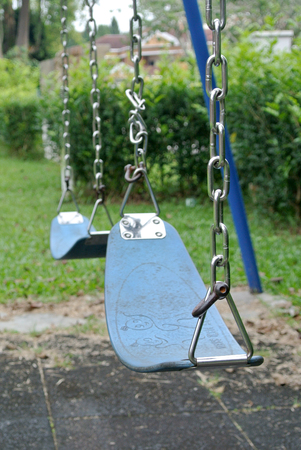 Children swing set in the public park.のeditorial素材
