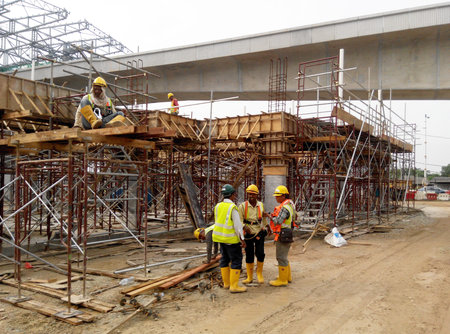 Construction workers fabricating timber form work at the construction site in Johor, Malaysia. The...