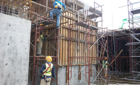 Construction workers fabricating timber form work at the construction site in Johor, Malaysia. The...