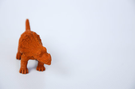 Triceratops model made from brown rubber isolated on white background.の写真素材