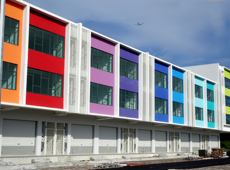 KUALA LUMPUR, MALAYSIA -DECEMBER 28, 2017: Two story shop lots with identical design and colorful facade.のeditorial素材