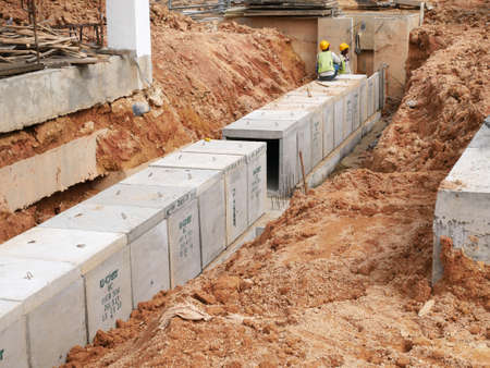 SELANGOR, MALAYSIA -JANUARY 19, 2020: Underground precast concrete box culvert drain under construction at the construction site. It is used to channel stormwater to the nearest monsoon drain.のeditorial素材