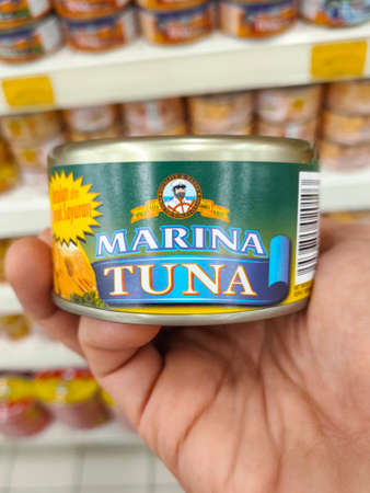 SEREMBAN, MALAYSIA -OCTOBER 5, 2020: Selected focused on tuna fish fillet in the metal can and displayed for sale on shelves in the supermarket. Its comes in a variety of taste and flavours.のeditorial素材