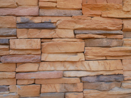 Slate brick in earth tone colour used as wall finishes. Installed overlap according to the method...