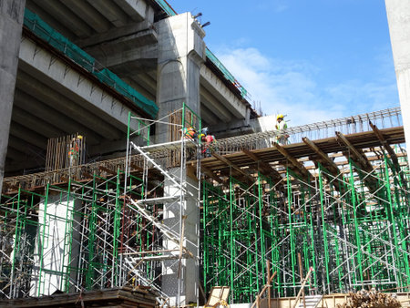 MALACCA, MALAYSIA -MARCH 12, 2020: Construction workers working at height at the construction site....