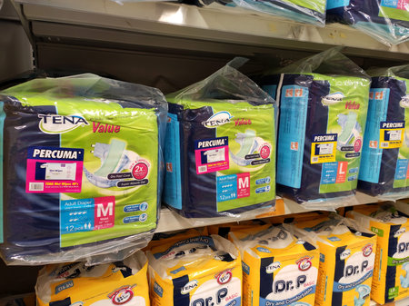 SEREMBAN, MALAYSIA -MARCH 2, 2020: Adult diapers displayed on the rack inside the hypermarket. Available in various sizes to suit customer needsのeditorial素材