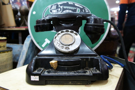 SEREMBAN, MALAYSIA -JUNE 5, 2020: Antique pull dial round phones are on display for sale at the pawnshop. The phone is still in its original condition and well maintained.のeditorial素材