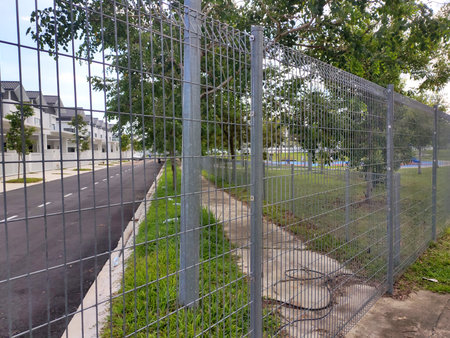 MELAKA, MALAYSIA -JUNE 5, 2020: Anti-climb fencing made from galvanized iron install at the...