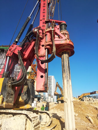 KUALA LUMPUR, MALAYSIA -MARCH 30, 2020: Bore pile rig machine at the construction site. The machine used to driven pile for building foundation work. Operated by skilled workers.のeditorial素材