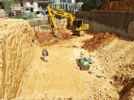 MALACCA, MALAYSIA -MARCH 5, 2020: Excavators machine at the construction site. It is used to...