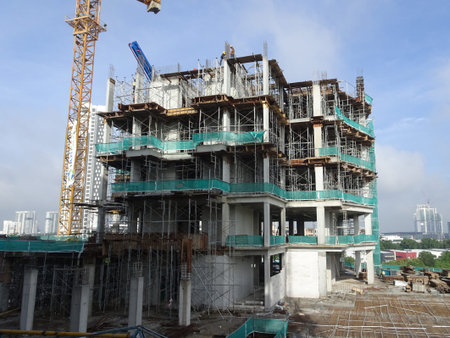 KUALA LUMPUR, MALAYSIA -APRIL 3, 2020:The construction site is operating during the day. Workers are...