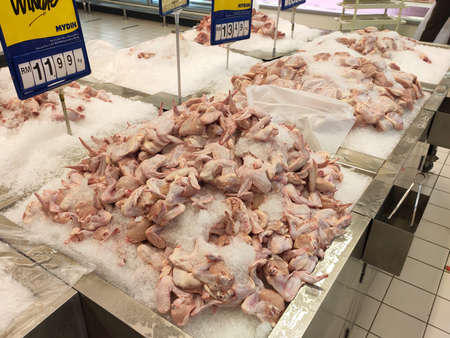 SEREMBAN, MALAYSIA -JULY 5, 2020: Supply of raw chicken in Malaysian supermarkets. Slaughtered chickens are sold in packages or cut into small pieces. Chickens are kept clean.のeditorial素材