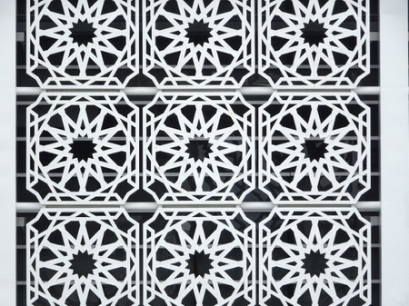 Islamic geometry pattern made from metals and ground fiber reinforcement concrete used as building facade as wall decoration.の写真素材