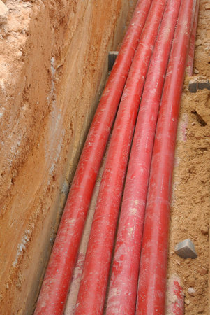 KUALA LUMPUR, MALAYSIA -APRIL 06, 2019: HDPE conduit pipe power conduit installed inside the ground trench. It is used to protect underground electrical and telecommunication cable.のeditorial素材