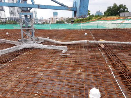 KUALA LUMPUR, MALAYSIA -MARCH 3, 2020: Building floor slab under construction. Construction workers...